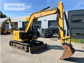 Minikuormaaja Cat 310: kuva Minikuormaaja Cat 310